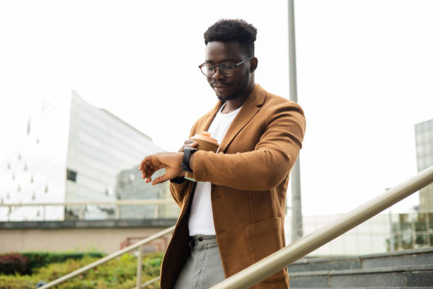 istock African businessman on a coffee break checking the time 1470608539