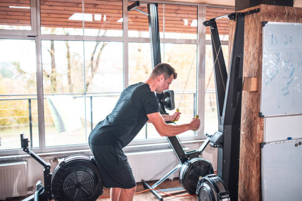 istock Confident male athlete pulling equipment at gym 1470610131