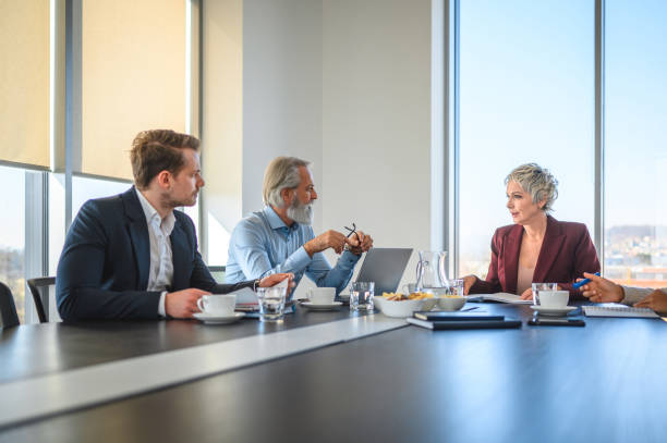 istock Caucasian Team at Modern Office, Talking and Researching 1470610157