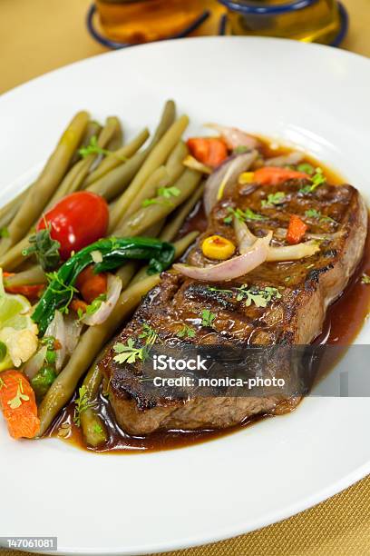 Roast Big Steak On Green Dish Close Up Stock Photo - Download Image Now - Strip Steak, American Bison, American Culture