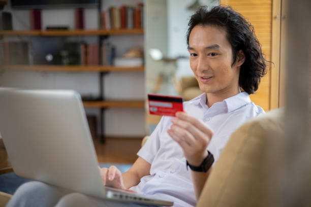 istock Happy young customer enjoys shopping online 1470612496