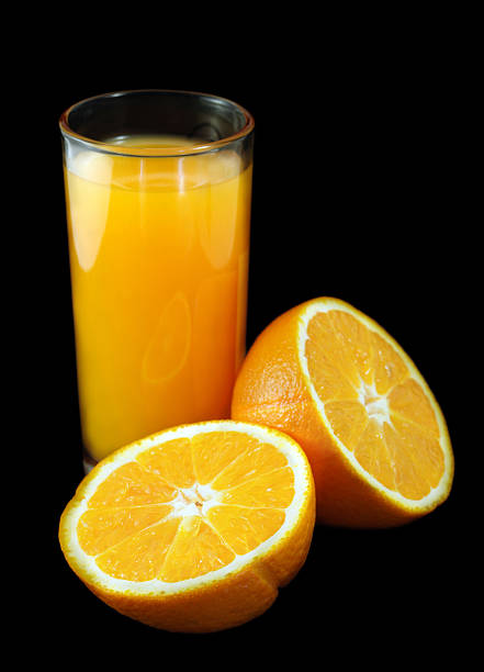 istock Orange juice on a black background. 147061419