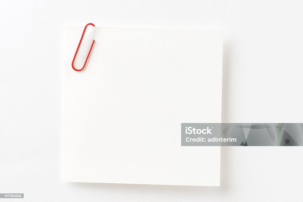 Blank note paper. Blank note paper with a paper clip on white paper background. (Adobe RGB). 2000-2009 Stock Photo