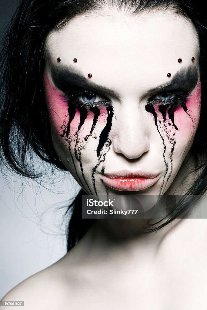 woman portrait with an original make-up black hair young woman portrait with an original colour make-up, studio shot Adult Stock Photo