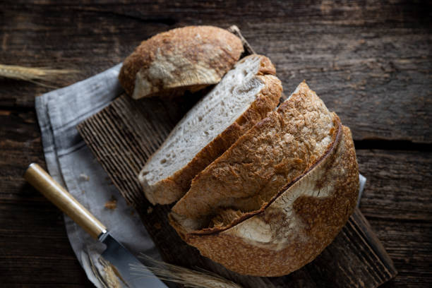 istock sourdough bread top view, sliced ​​natural bread on wooden background 1470617549