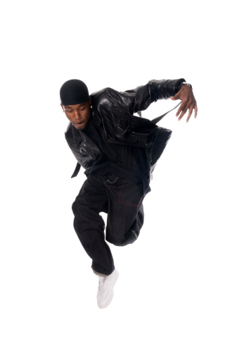 Cool young hip-hop dancer wearing do rag and leather jacket isolated on white background