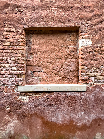 Walls of Venice: Traditional brick textured wall background in design loft style. Grunge reddish brown colored with copy space. Blank poster or wallpaper surface template. Partly damaged pattern.