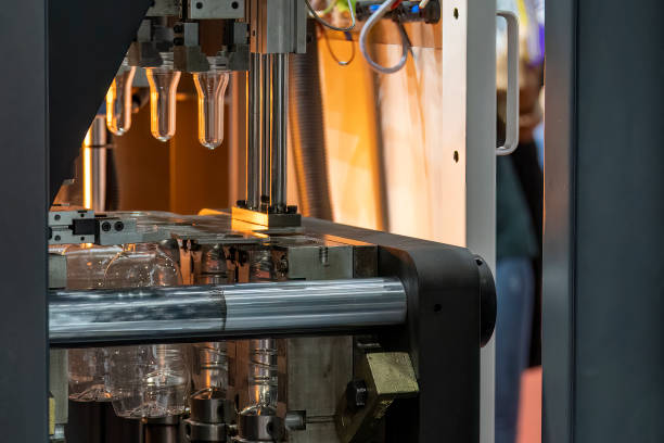 istock The drinking water bottle manufacturing process by blow mold machine. 1470623990