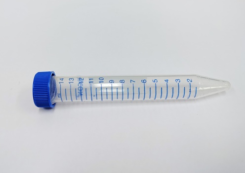 A medical scene containing a syringe, vial of vaccine and a stethoscope shot in studio against a white background.