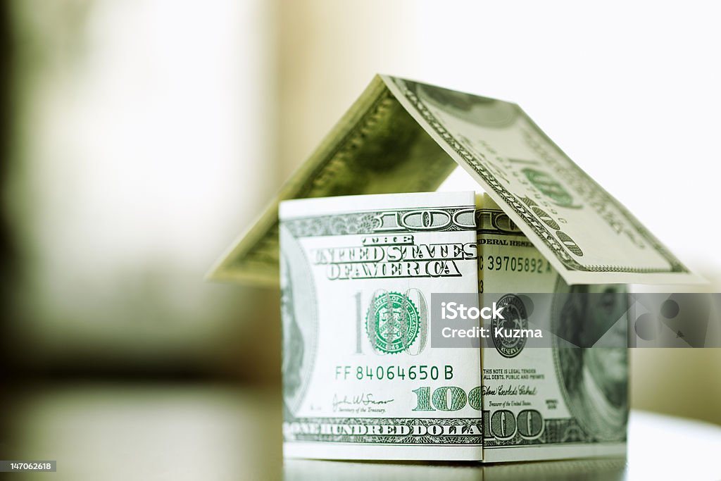 finance concept a house made from bills of 100 dollars, dof f/x, selective focus House Stock Photo