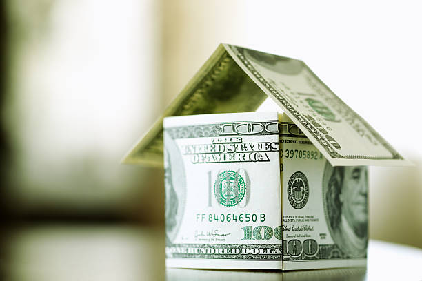 finance concept a house made from bills of 100 dollars, dof f/x, selective focus price tag photos stock pictures, royalty-free photos & images