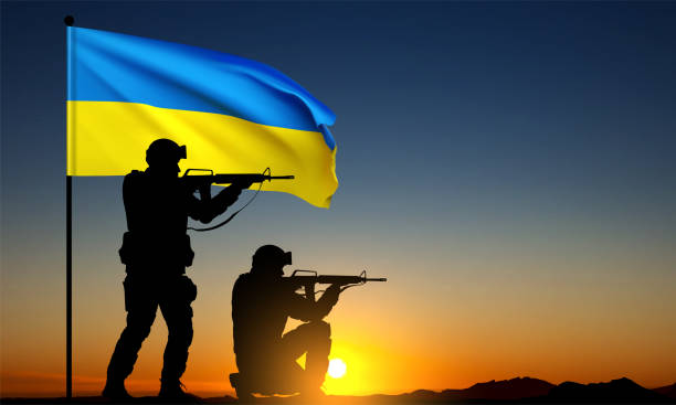 istock Silhouettes of soldiers with Ukraine flag 1470632183