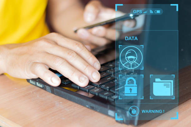 istock Mobile hacker and computer cyber security, online data breach or identity theft. hacked phone Hacker and mobile phone with hologram data Mobile scams, fraud or crime cyber security breach 1470634794