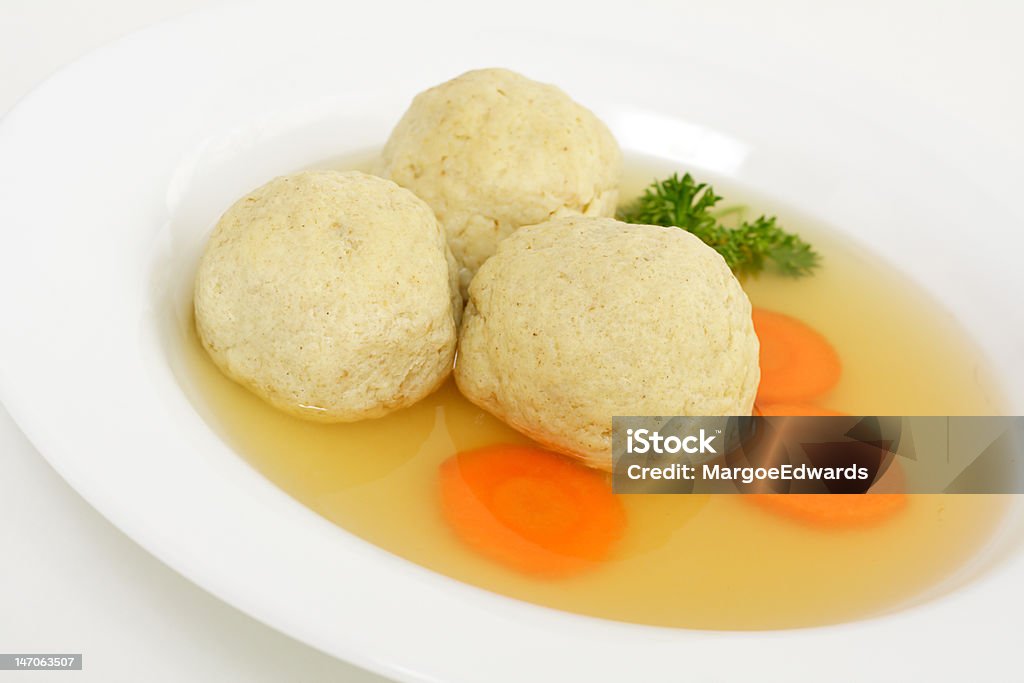 Matzo ball soup Traditional kosher soup served during seder dinner at Passover Circle Stock Photo