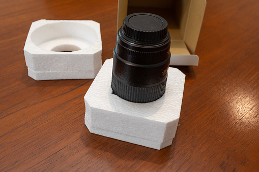 Camera lens with styrofoam protective packaging