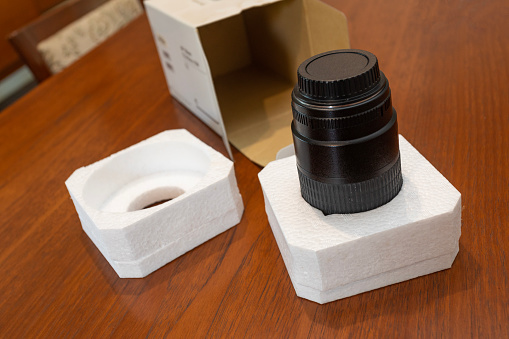 Camera lens with styrofoam protective packaging