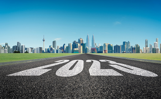 Number 2021 on asphalt road with beautiful roadside scenery