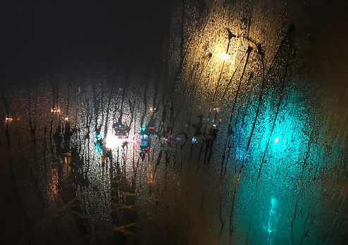Rainy night behind misted glass in Istanbul, Turkey.