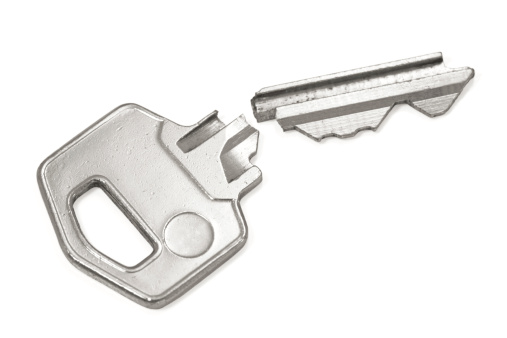 Broken silver key isolated on a white background
