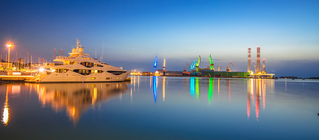 City of Pula shipyard illuminated cranes evening view, Istria region of Croatia