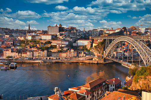 View of Ribeira district in Porto with Dom Luis Bridge crossing Douro river
