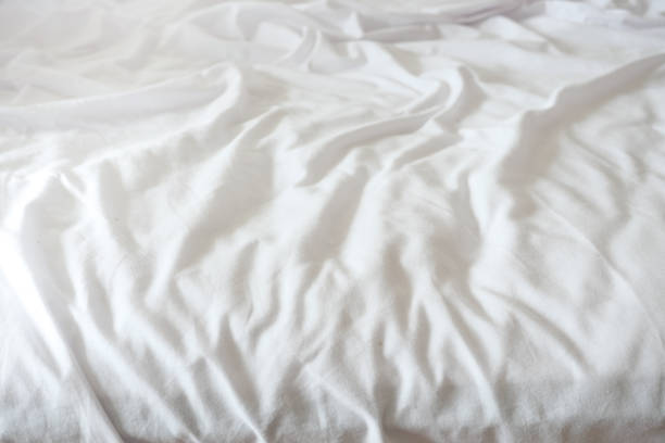 istock messy bed in early morning , messy bed after waking up 1470648920