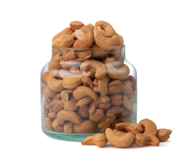 istock Cashews in a transparent jar on white background 1470654673