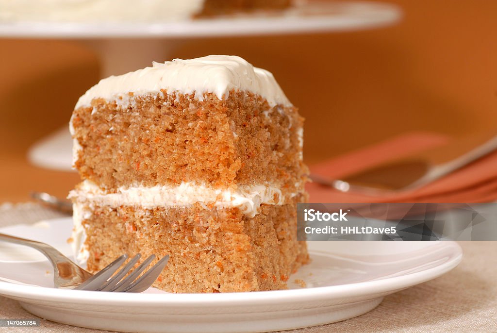 Carrot cake Slice of freshly baked carrot cake with cream cheese frosting Baked Stock Photo