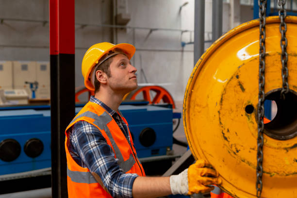 istock Young businessman holding and working with remote control for operating crane 1470658217