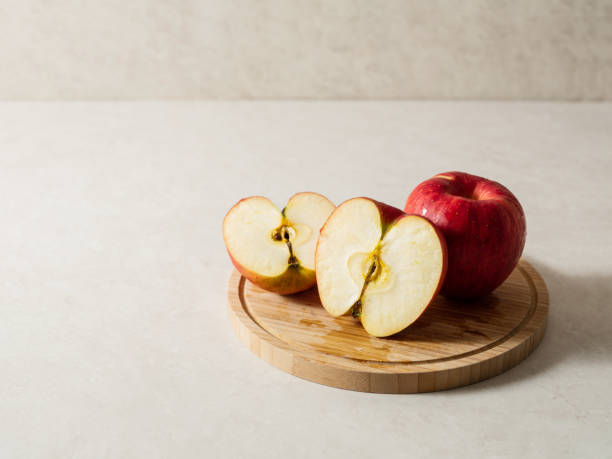 istock red apples on a wooden chopping board 1470658644