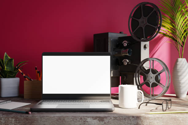 istock A blank laptop screen with a movie projector is in front of a magenta wall, 3d rendering 1470658758
