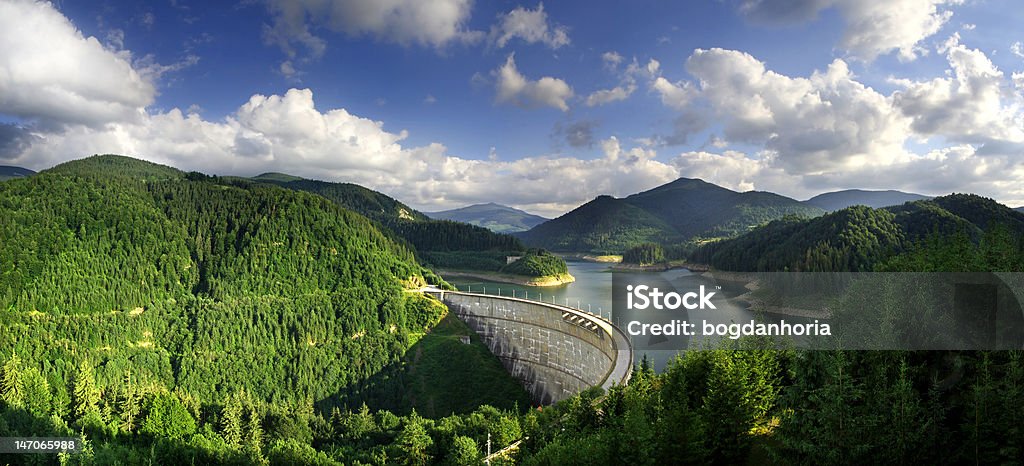 Artificial dam panorama- Valea Draganului, Romania A panorama from the big dam from Valea Draganului, Romania Hydroelectric Power Stock Photo