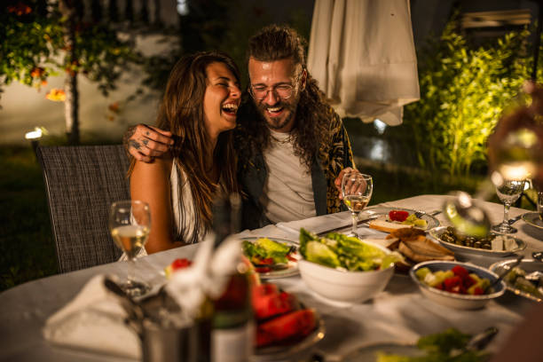 istock Happy couple at the summer dinner party 1470660886