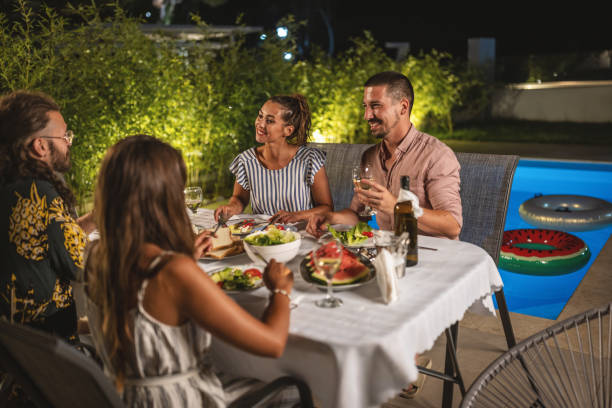 istock Friends enjoy in summer evening dinner party 1470660901