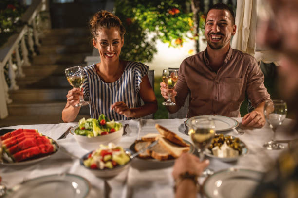 istock Young couple on a summer dinner party 1470662959