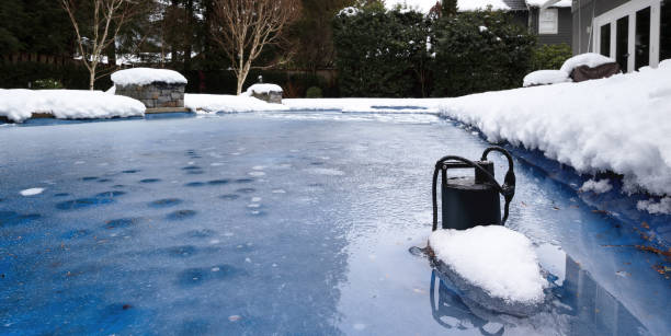 istock Automatic pool pump in ice and slush after snow storm. 1470663792