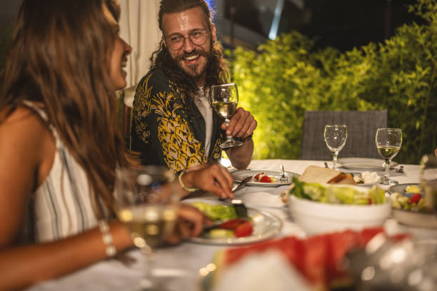 istock Happy couple having fun on a dinner party 1470664995