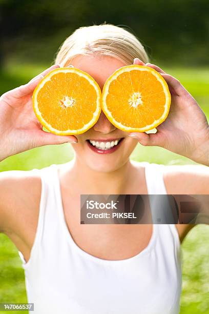 Woman Holding Oranges Over Eyes Stock Photo - Download Image Now - Adult, Adults Only, Beautiful People