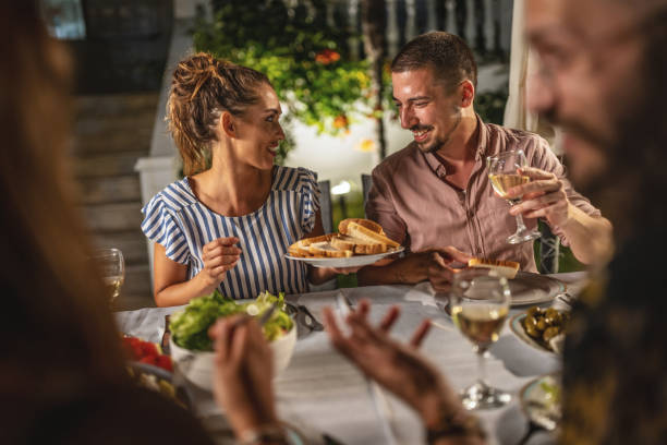 istock Young couple on a summer dinner party 1470665987