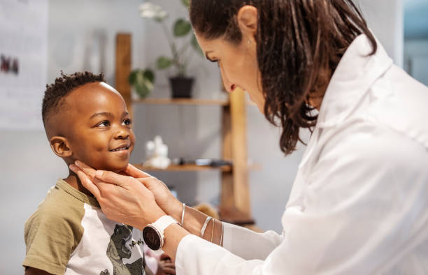 istock Doctor examining a smiling little boy during a checkup 1470666102