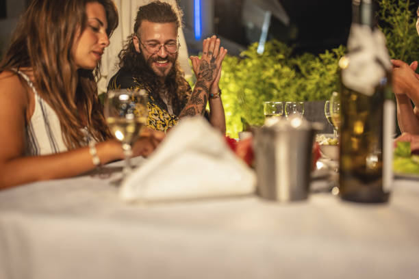 istock Young couple on a summer dinner party 1470666194