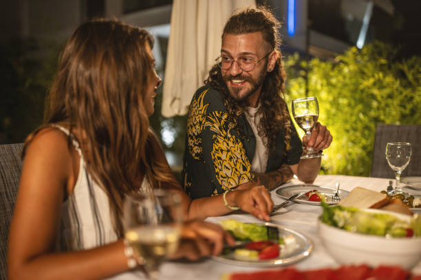 istock Happy couple having fun on a dinner party 1470666286