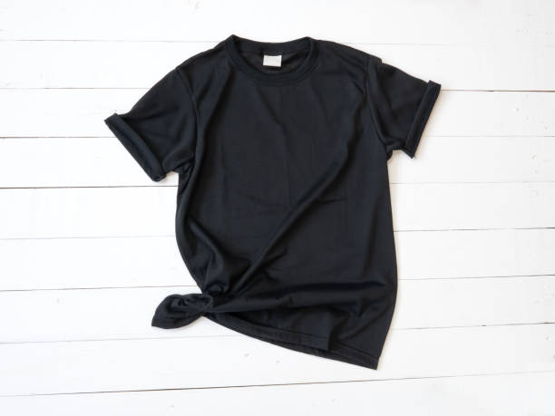 istock Black T Shirt mockup on white wood background 1470674069
