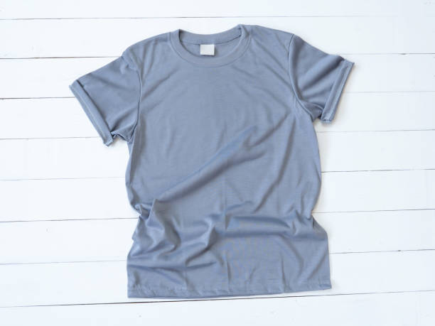 istock Grey T Shirt mockup on white wood background 1470674166