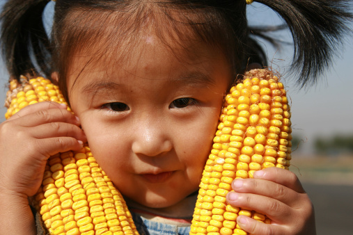 happy girl and corn