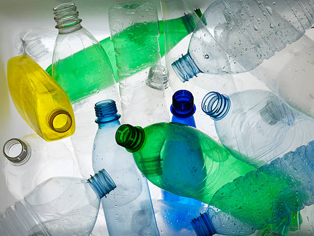 Backlit collection of colourful plastic bottles