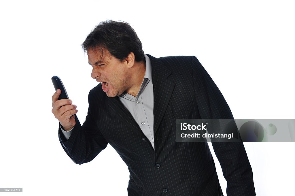 Foto Studio de un hombre de negocios gritar en su teléfono. - Foto de stock de Capataz libre de derechos