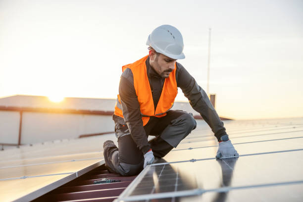 istock The worker is installing solar panels on the rooftop. 1470677986