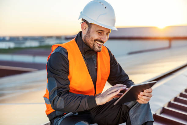 istock Happy worker is scrolling on tablet and controlling solar panels. 1470679986