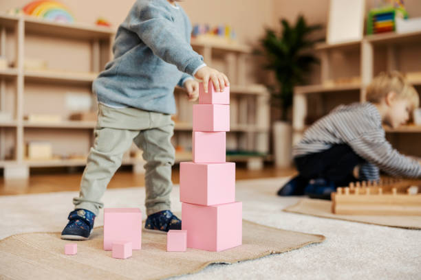 istock Cropped picture of a kindergartener making blocks tower at nursery. 1470680764